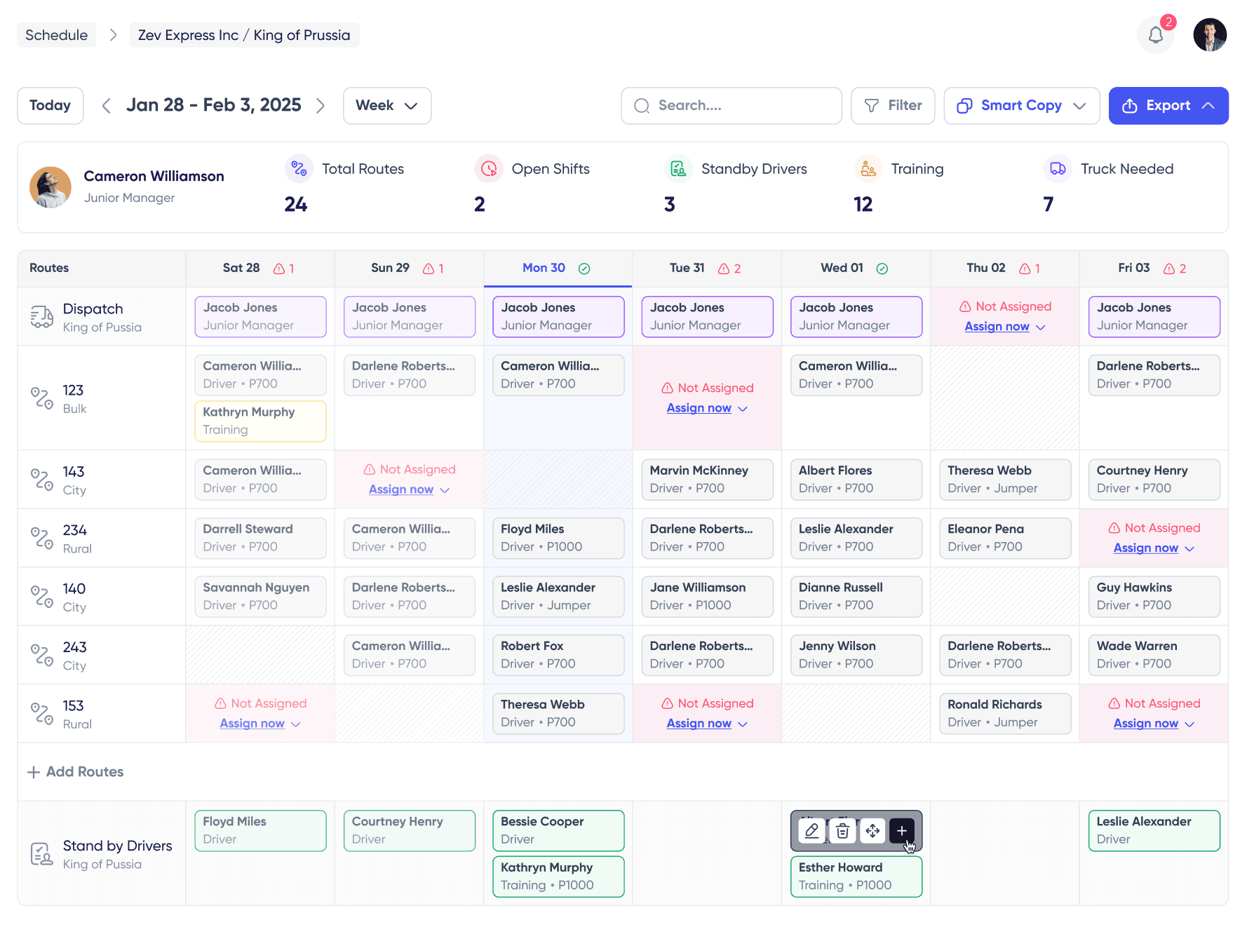 FleetWage scheduling view with weekly route grid showing driver assignments across multiple stations